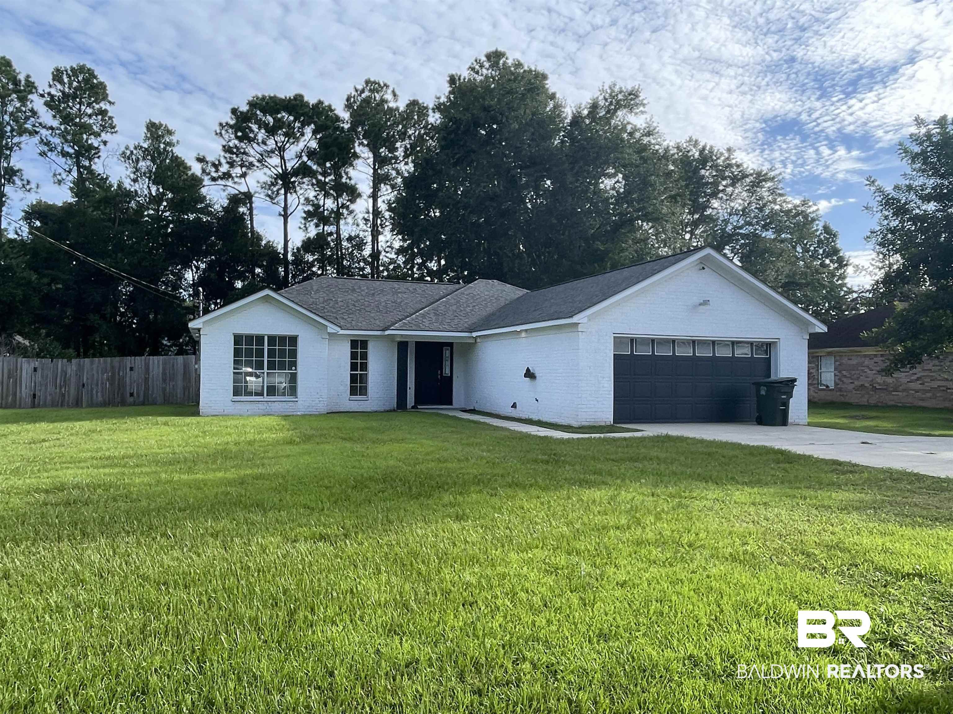 513 East Michigan Avenue Foley, AL 36535 - Photo 1 of 1 Single story home with a front lawn and a garage