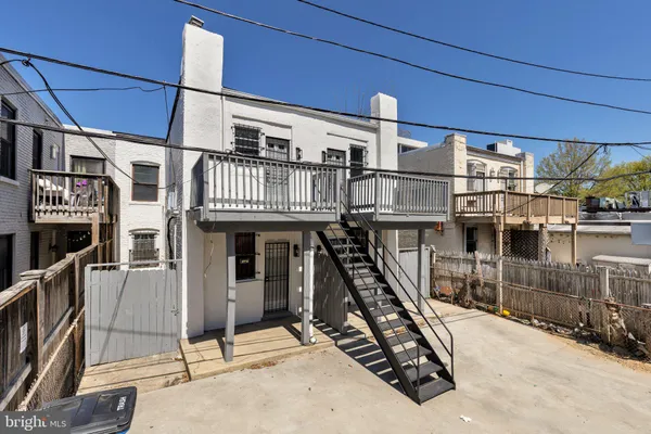 a kitchen with a refrigerator a stove top oven a sink and a refrigerator