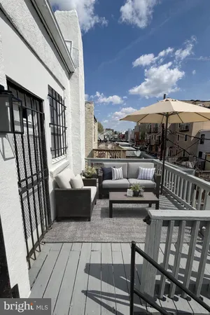 a kitchen with stainless steel appliances a stove microwave and sink