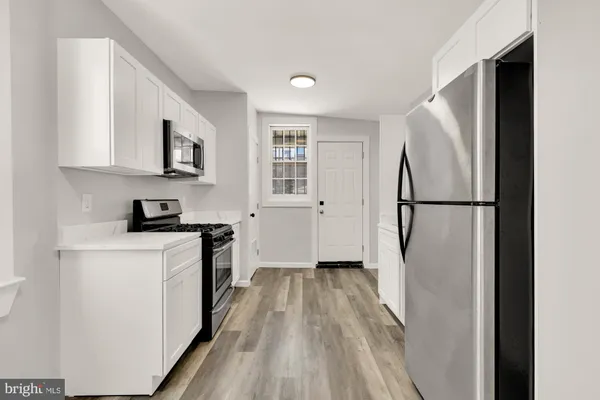 a picture of a book and a white wall