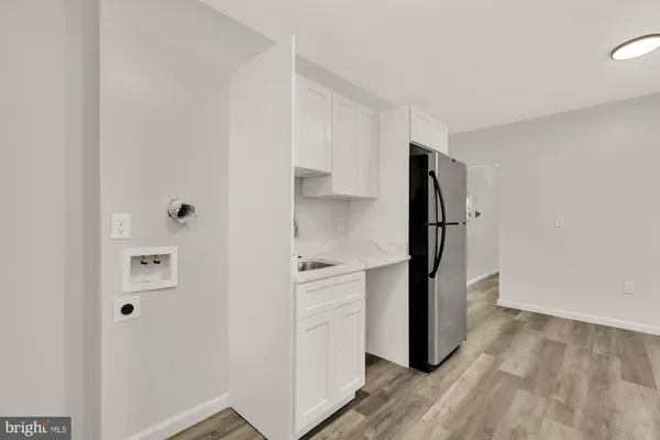 a view of an empty room and wooden floor