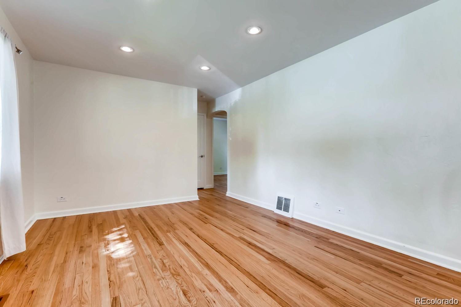 1610 South Cook Street Denver, CO 80210 - Photo 12 of 37 a view of empty room with wooden floor