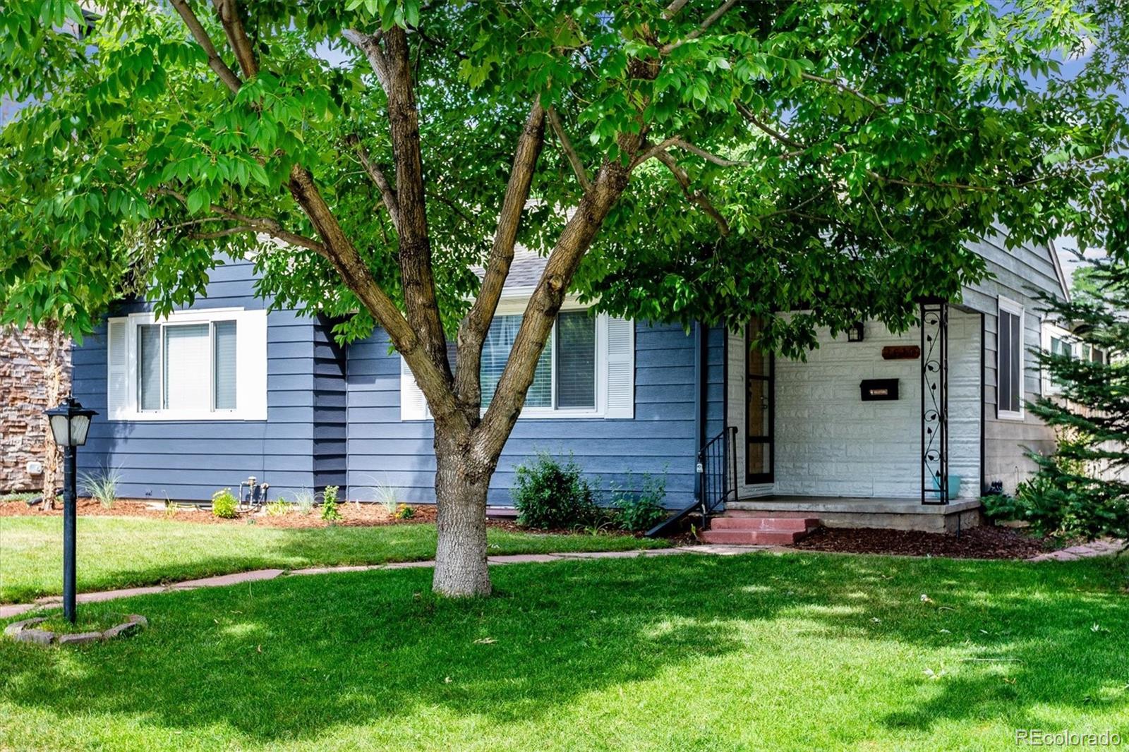 1610 South Cook Street Denver, CO 80210 - Photo 2 of 37 front view of a house with a yard