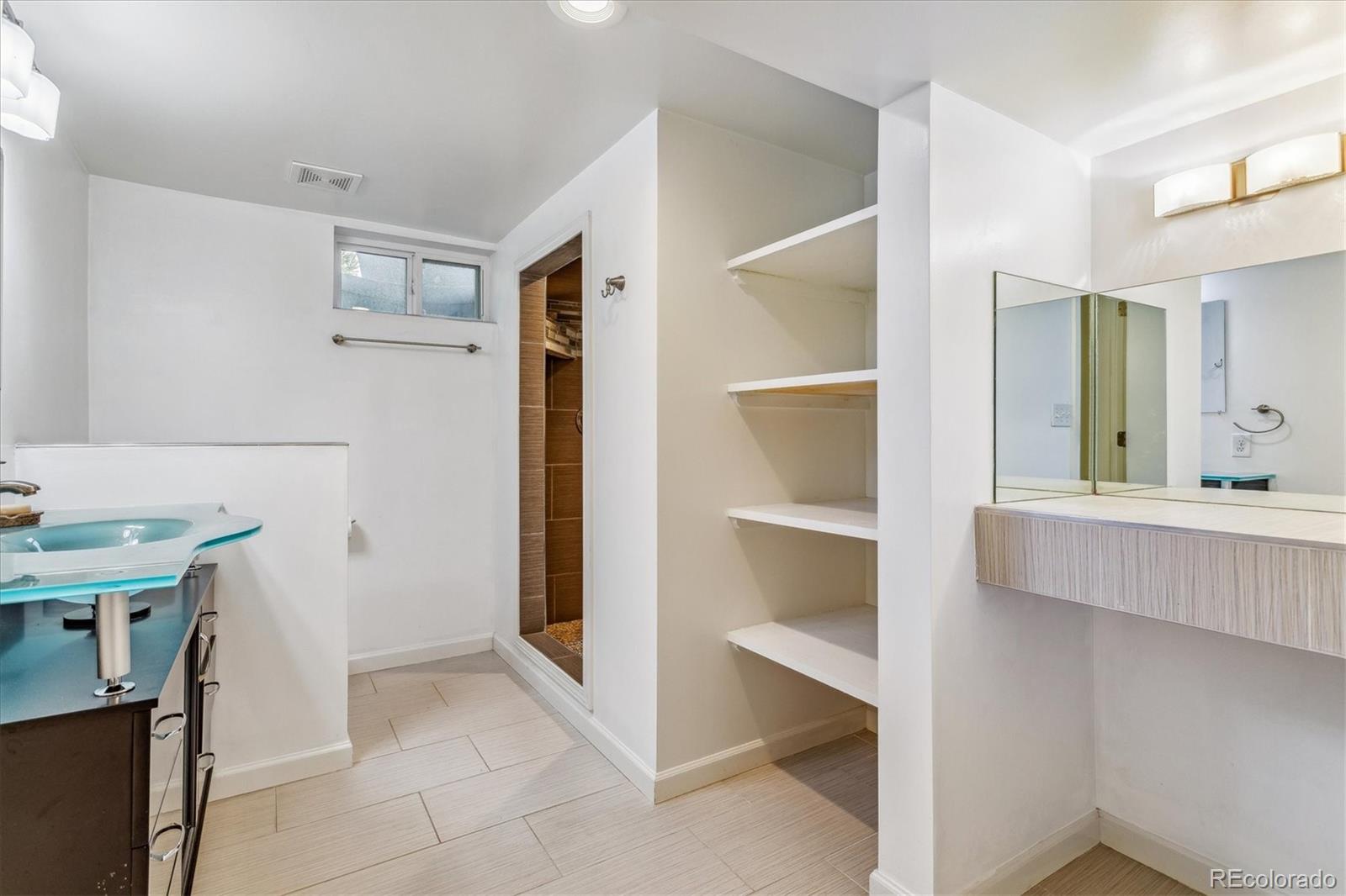 1610 South Cook Street Denver, CO 80210 - Photo 22 of 37 a view of cabinets with a wooden floor