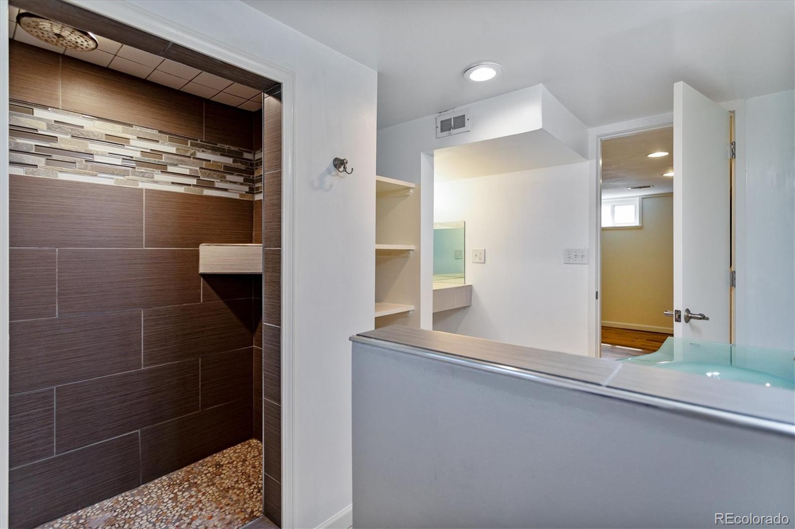1610 South Cook Street Denver, CO 80210 - Photo 23 of 37 a bathroom with a shower and a sink