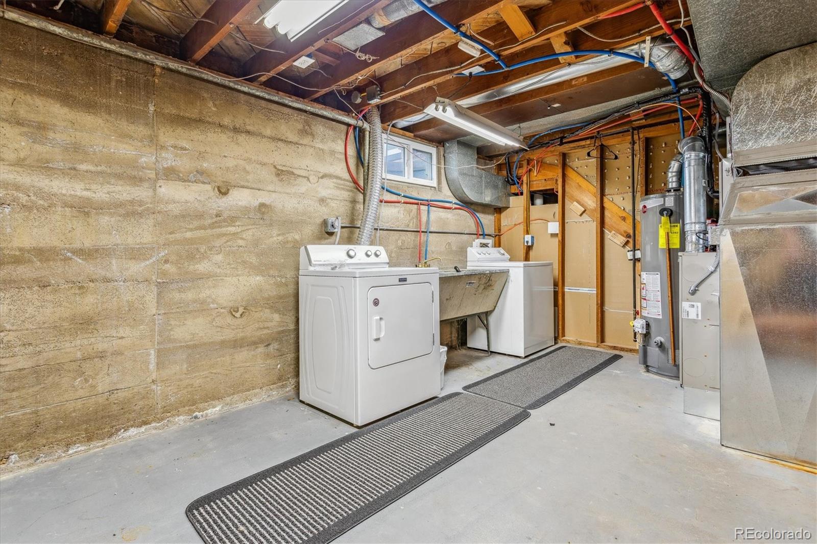 1610 South Cook Street Denver, CO 80210 - Photo 25 of 37 a utility room with dryer and washer