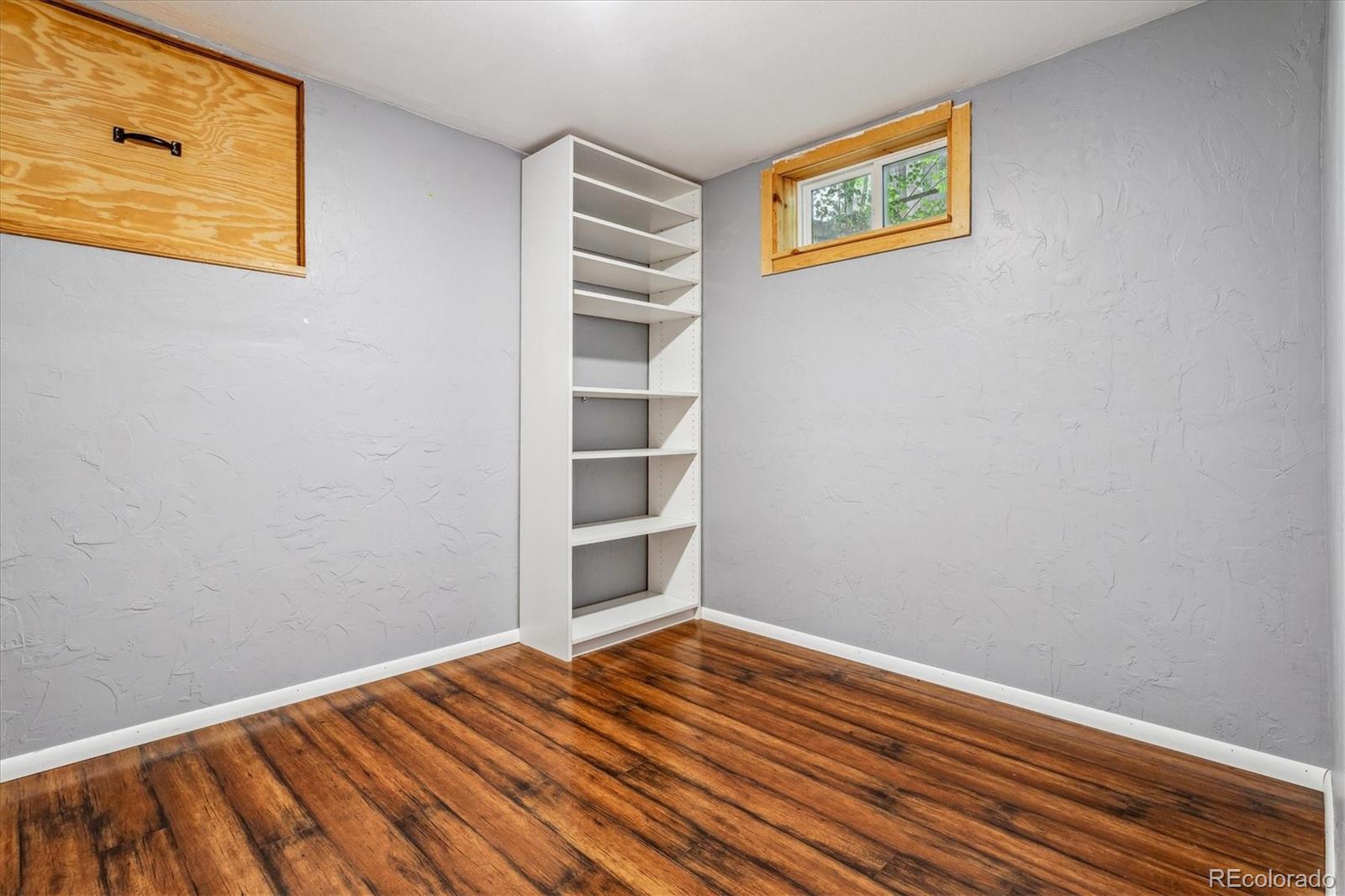 1610 South Cook Street Denver, CO 80210 - Photo 28 of 37 a view of a room with wooden floor and closet
