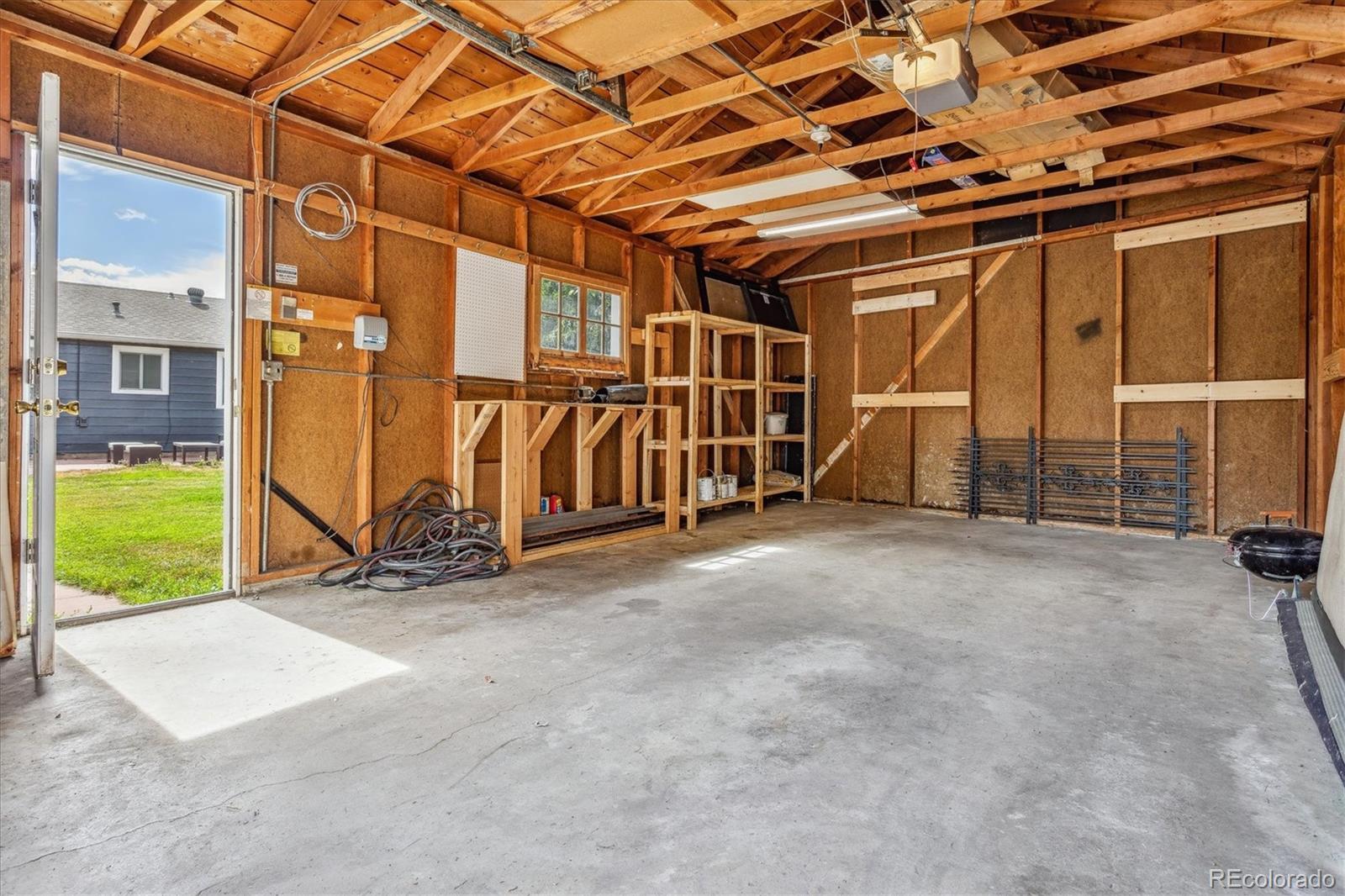 1610 South Cook Street Denver, CO 80210 - Photo 34 of 37 a view of an empty room with wooden walls