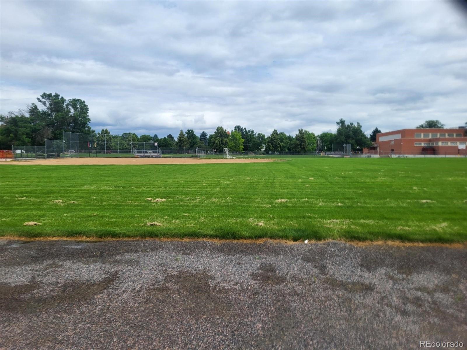 1610 South Cook Street Denver, CO 80210 - Photo 36 of 37 a view of a field with grass and trees