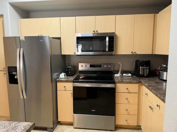 a kitchen with a stove microwave and refrigerator