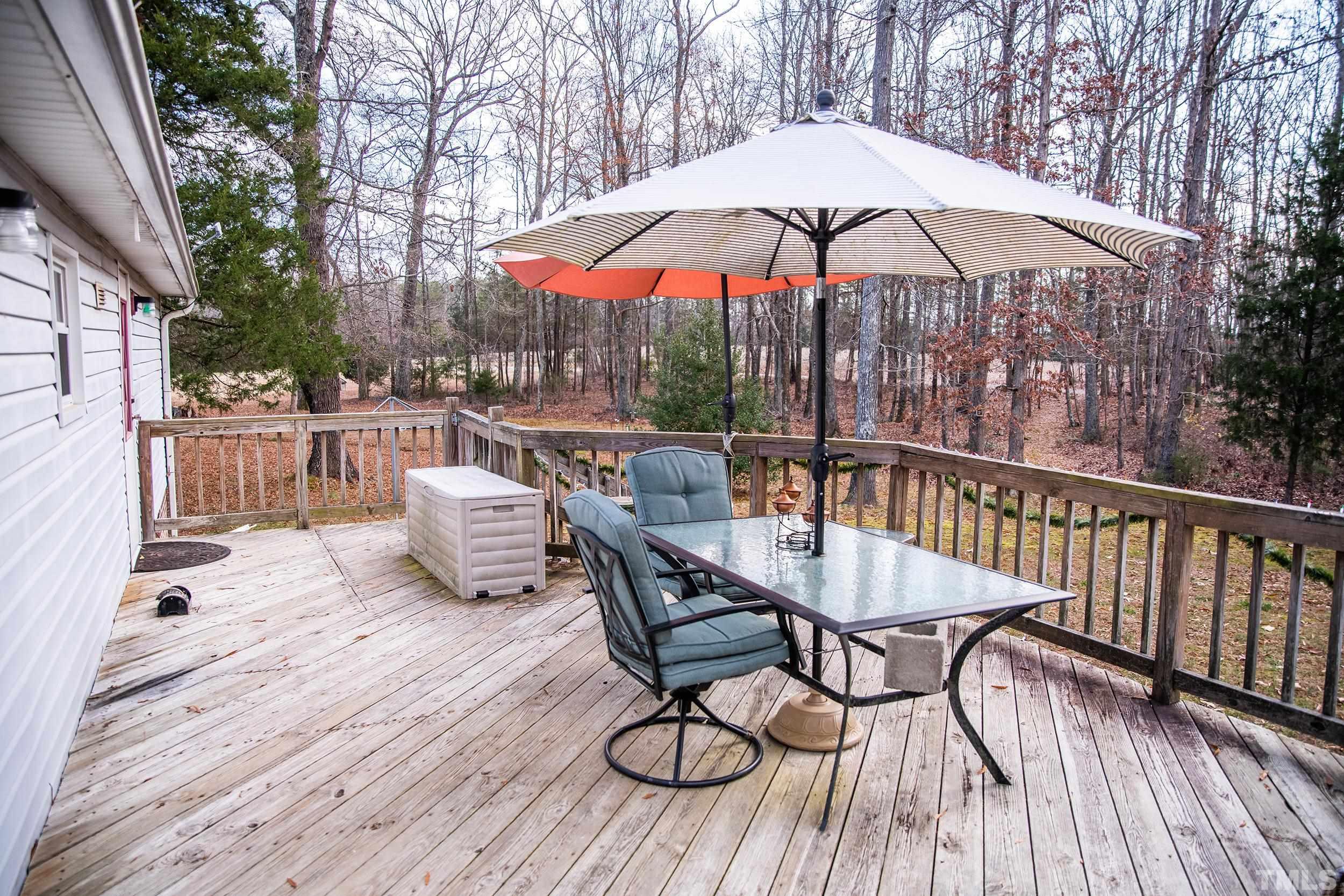 6180 Helena Moriah Road Rougemont, NC 27572 - Photo 27 of 41 a view of balcony with wooden floor and outdoor seating