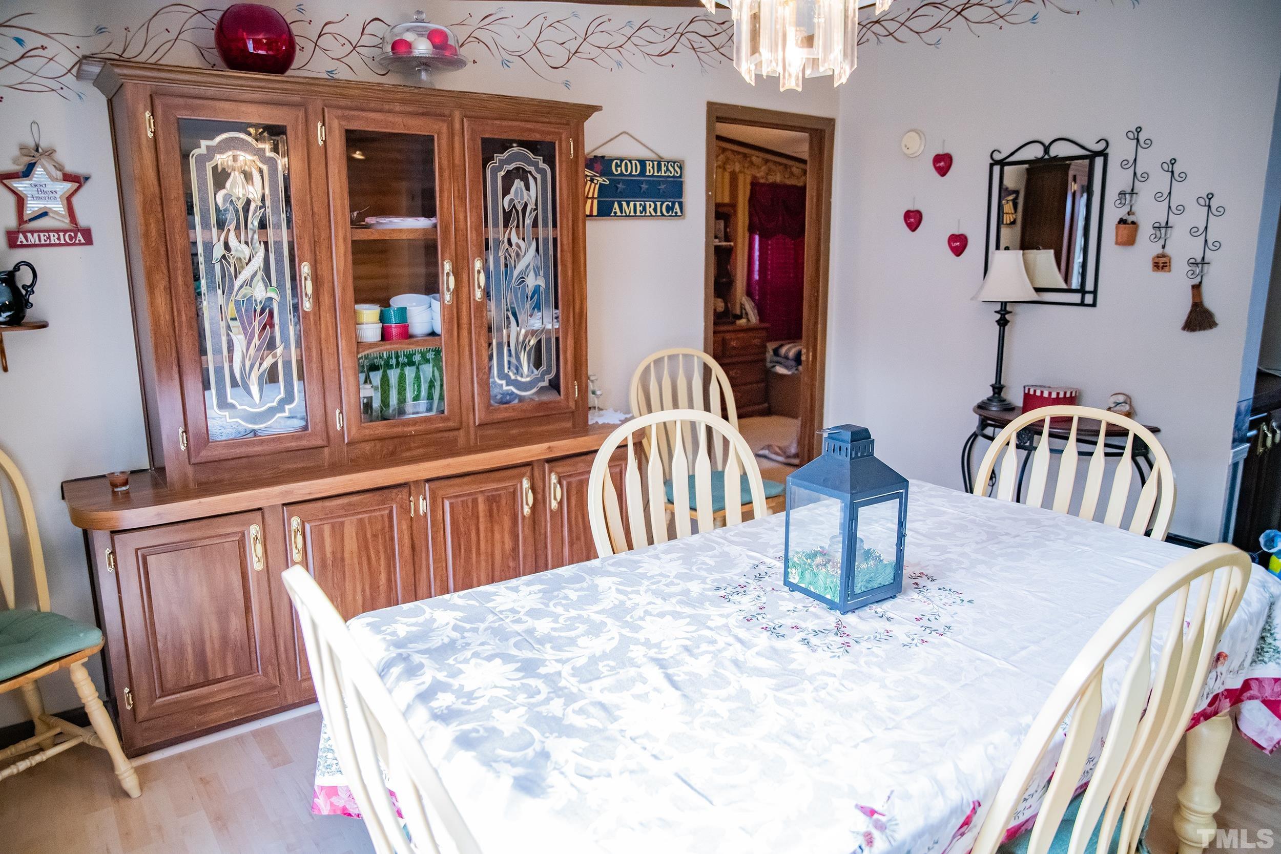 6180 Helena Moriah Road Rougemont, NC 27572 - Photo 8 of 41 a dining room with furniture and wooden floor