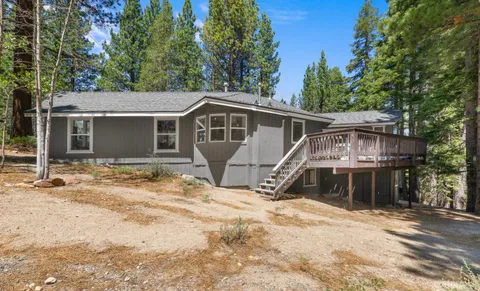 a view of a house with a tree