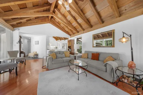 a dining room with furniture mountain view and balcony
