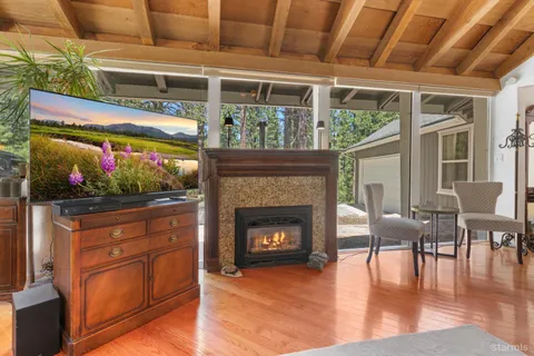 a kitchen with granite countertop a sink stainless steel appliances and cabinets