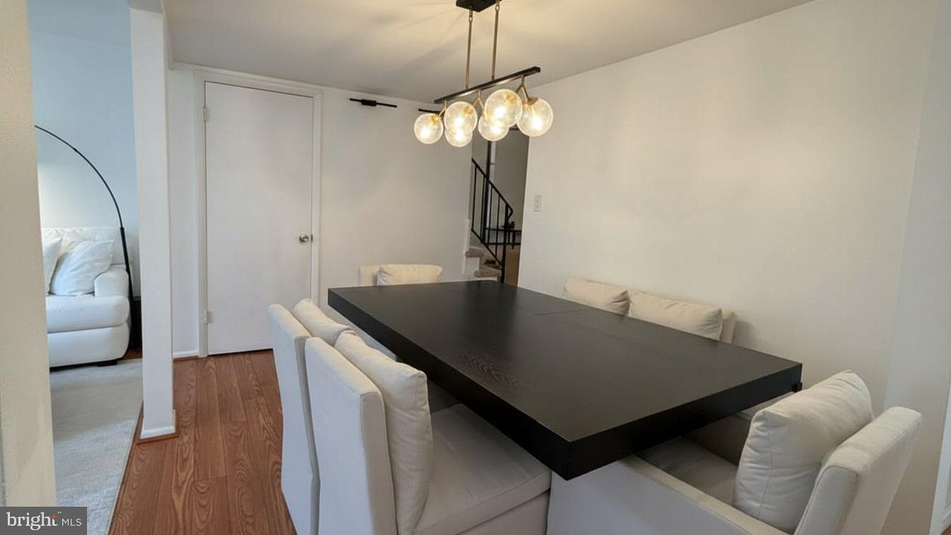 16031 Dorset Road, Unit 161 Laurel, MD 20707 - Photo 11 of 25 a view of a room with furniture and wooden floor