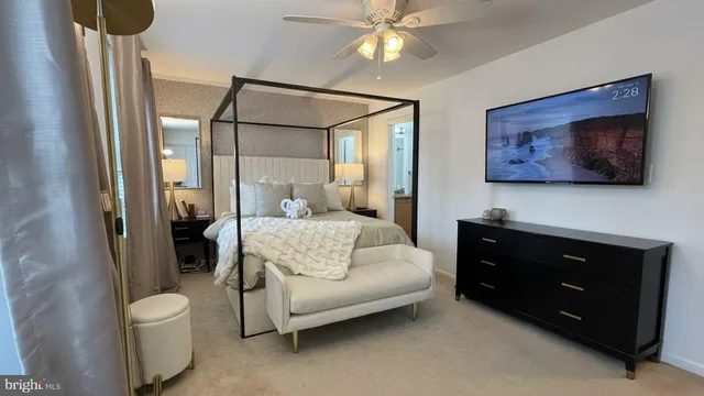a spacious bedroom with a bed and a mirror