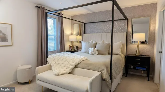 a bedroom with a bed and a mirror
