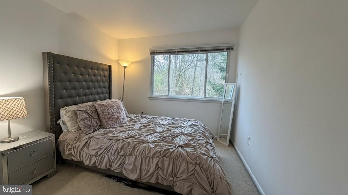 16031 Dorset Road, Unit 161 Laurel, MD 20707 - Photo 20 of 25 a bedroom with a bed and a window