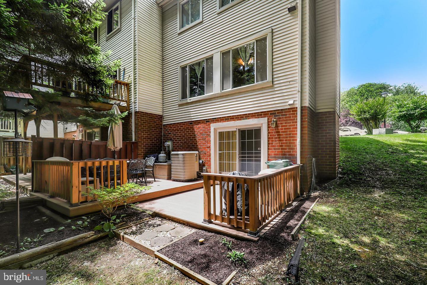 16031 Dorset Road, Unit 161 Laurel, MD 20707 - Photo 25 of 25 a view of a house with backyard and porch