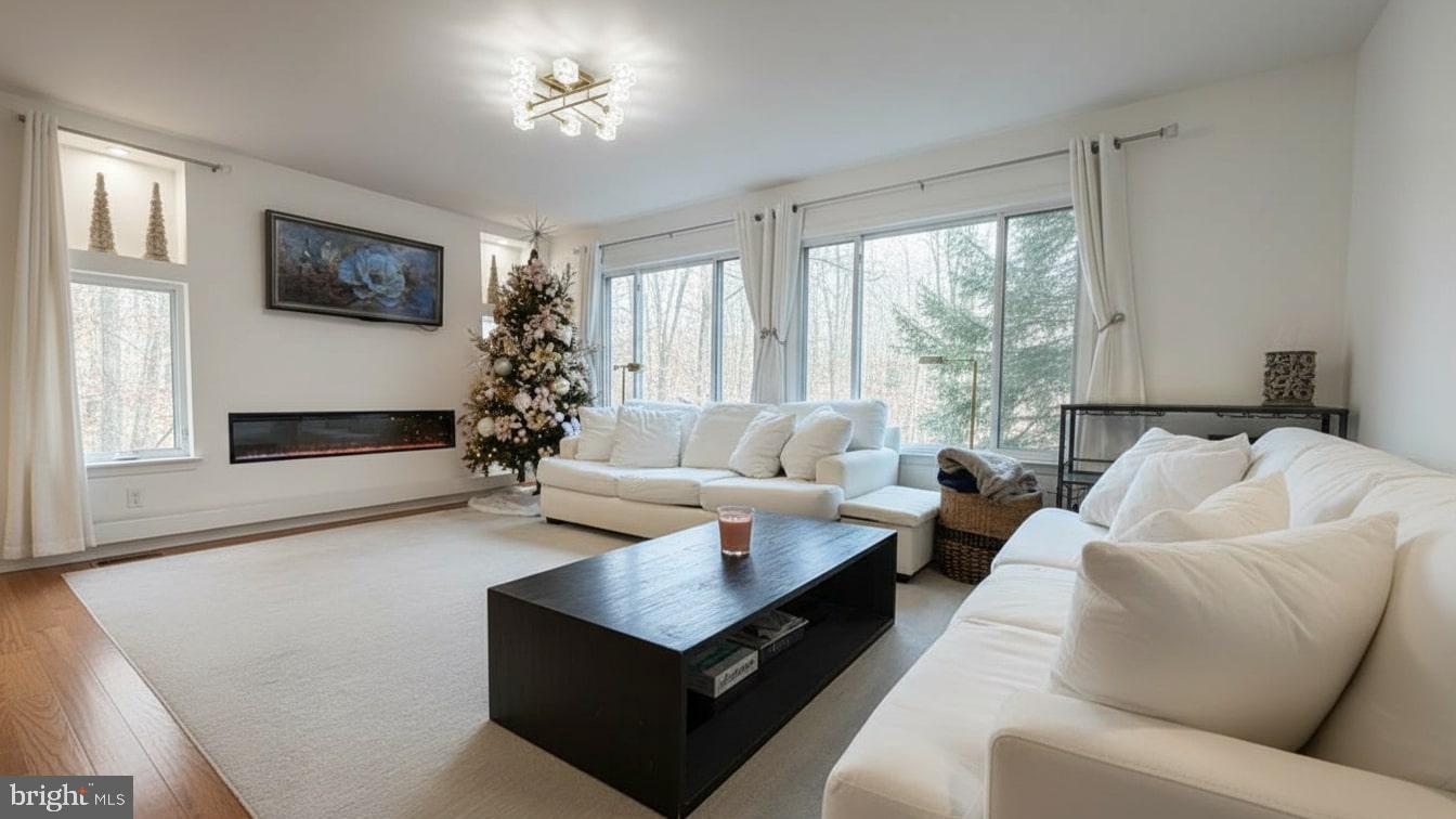 16031 Dorset Road, Unit 161 Laurel, MD 20707 - Photo 7 of 25 a living room with furniture flower pot and a large window