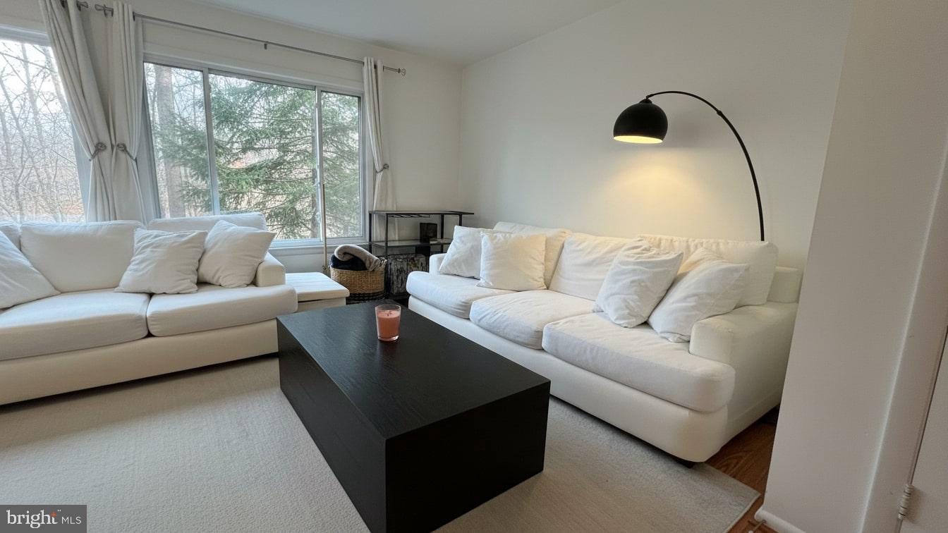16031 Dorset Road, Unit 161 Laurel, MD 20707 - Photo 8 of 25 a living room with furniture and a large window