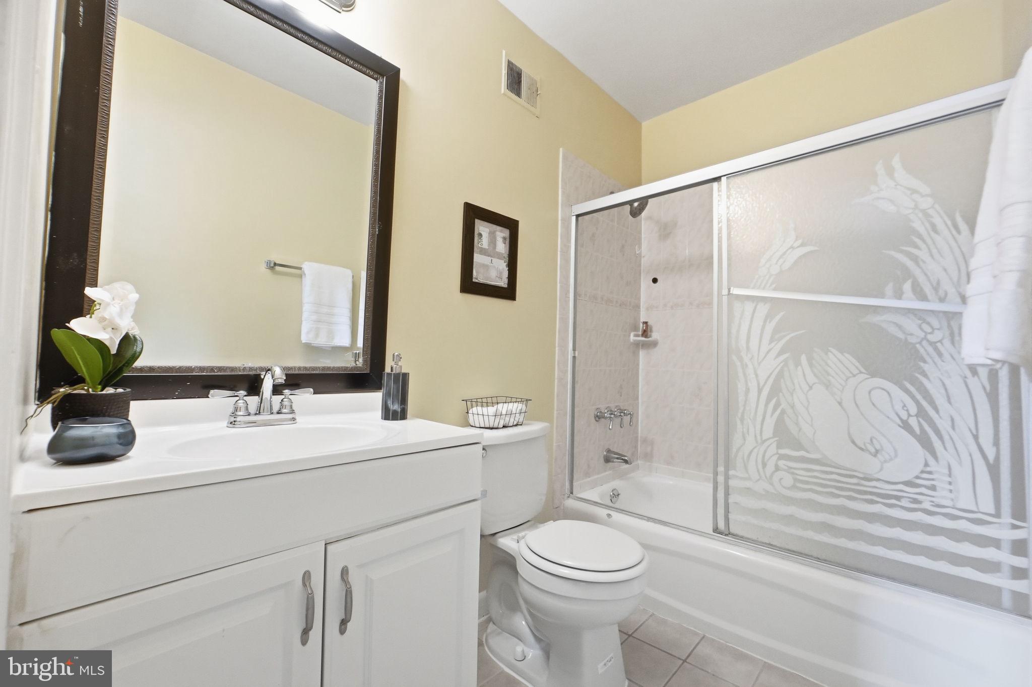 6470 Franconia Court Springfield, VA 22150 - Photo 14 of 31 a bathroom with a sink a toilet and shower