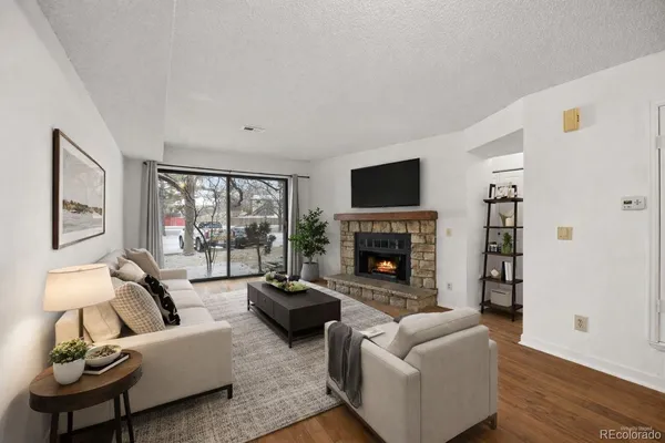 a living room with furniture fireplace and a flat screen tv