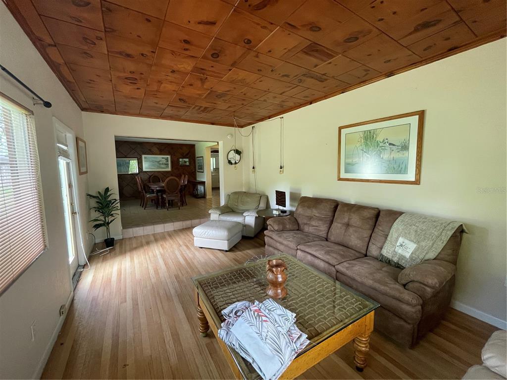 11636 Osceola Road Dunnellon, FL 34431 - Photo 11 of 34 a living room with furniture and a wooden floor