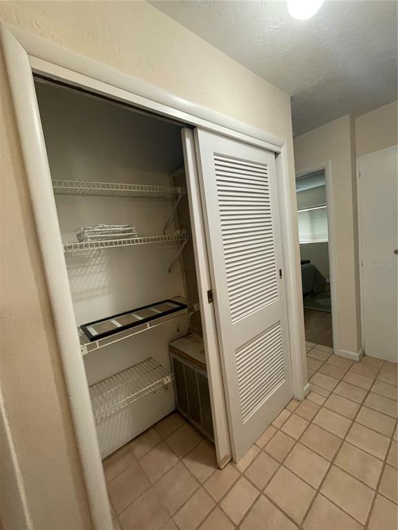 11636 Osceola Road Dunnellon, FL 34431 - Photo 14 of 34 a storage room with cabinets
