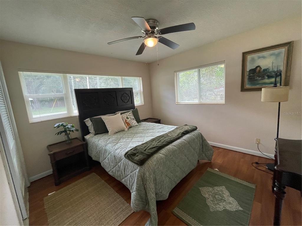 11636 Osceola Road Dunnellon, FL 34431 - Photo 21 of 34 a bed sitting in a bedroom next to a window