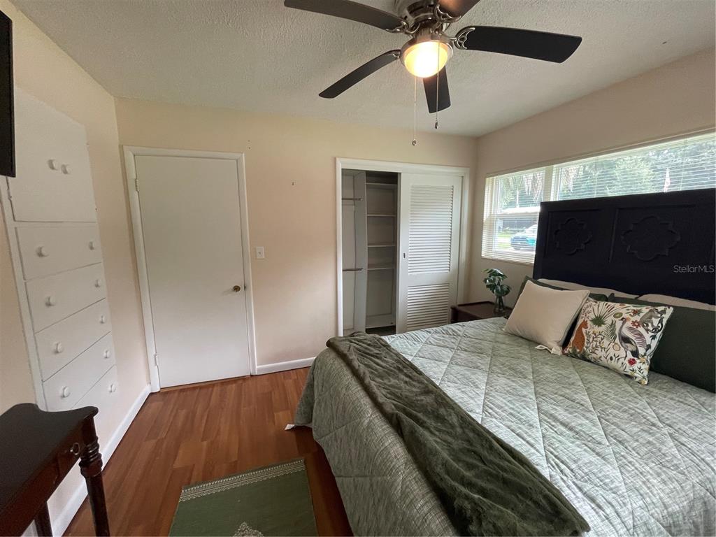 11636 Osceola Road Dunnellon, FL 34431 - Photo 22 of 34 a bedroom with a bed and a flat screen tv