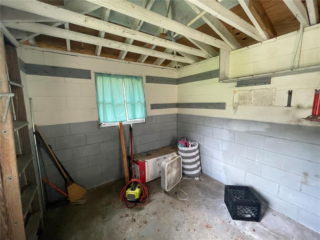 11636 Osceola Road Dunnellon, FL 34431 - Photo 31 of 34 a bathroom with a sink and a washing machine