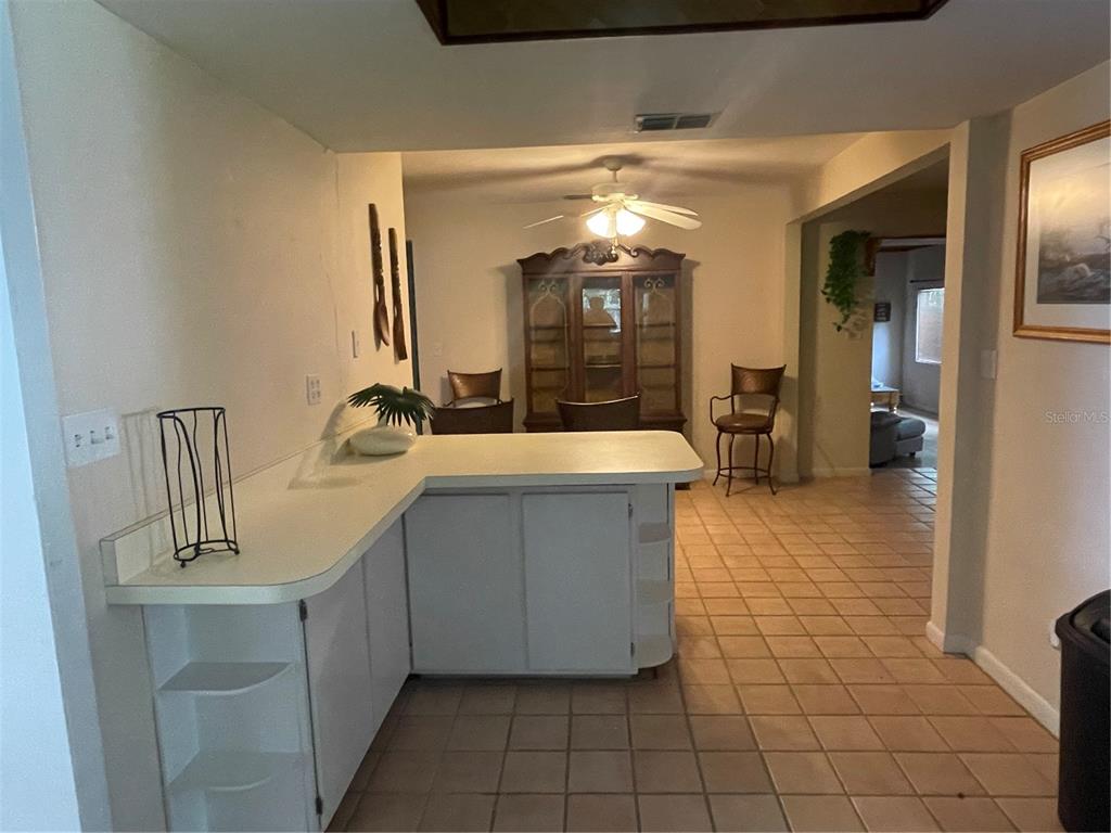 11636 Osceola Road Dunnellon, FL 34431 - Photo 6 of 34 a bathroom with a sink a mirror and shower
