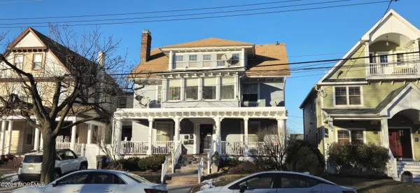 a front view of a building with street view