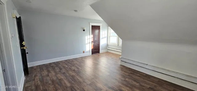 a view of livingroom with hardwood and stairs