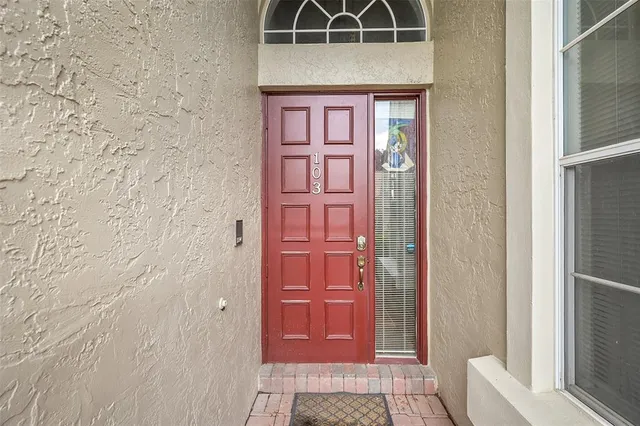 a view of a hallway with furniture and a rug