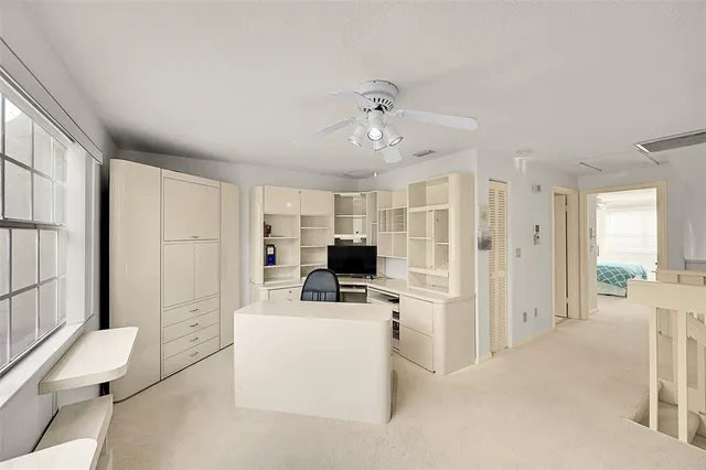 a bedroom with a bed a couch and dresser