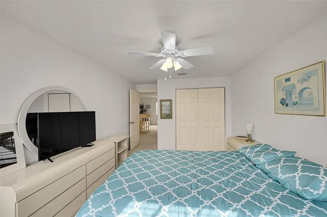 a living room with furniture large window and flat screen tv