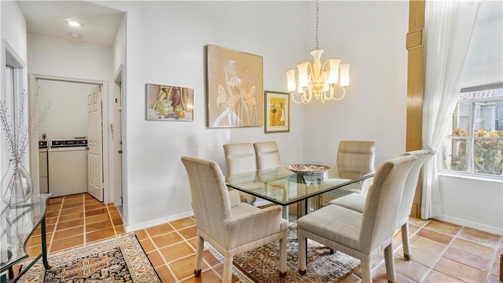 17210 Boca Club Boulevard, Unit 103 Boca Raton, FL 33487 - Photo 6 of 15 a dining room with furniture and window