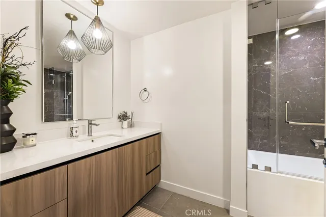 a bathroom with a double vanity sink and a mirror