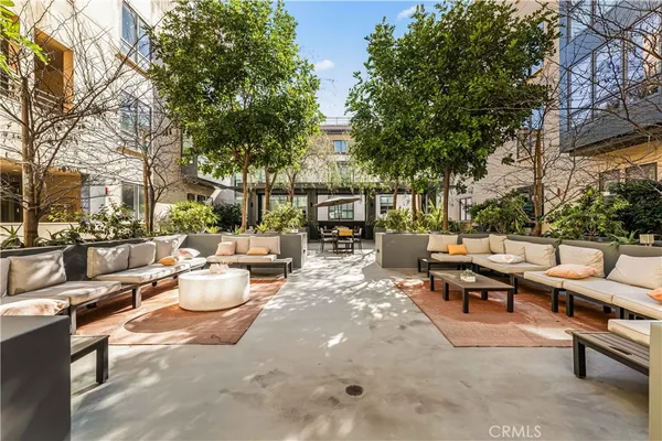 a view of a patio with chairs and tables