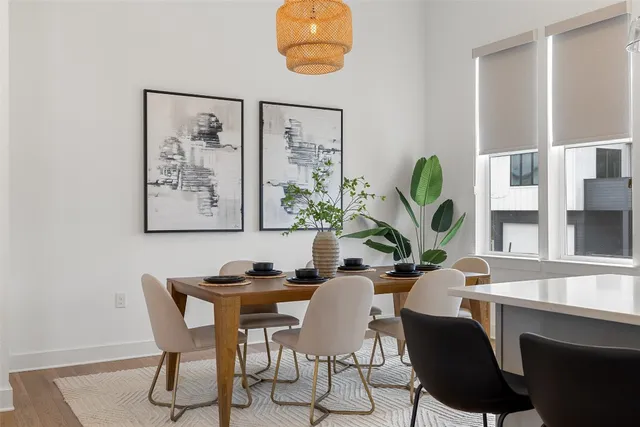a dining room with furniture and window