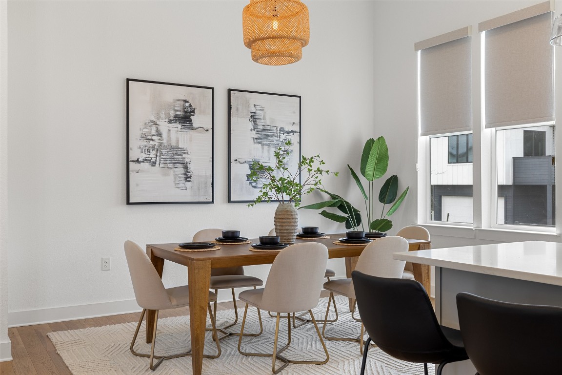 4400 Night Owl Lane Austin, TX 78723 - Photo 14 of 40 a view of a dining room with furniture and a potted plant