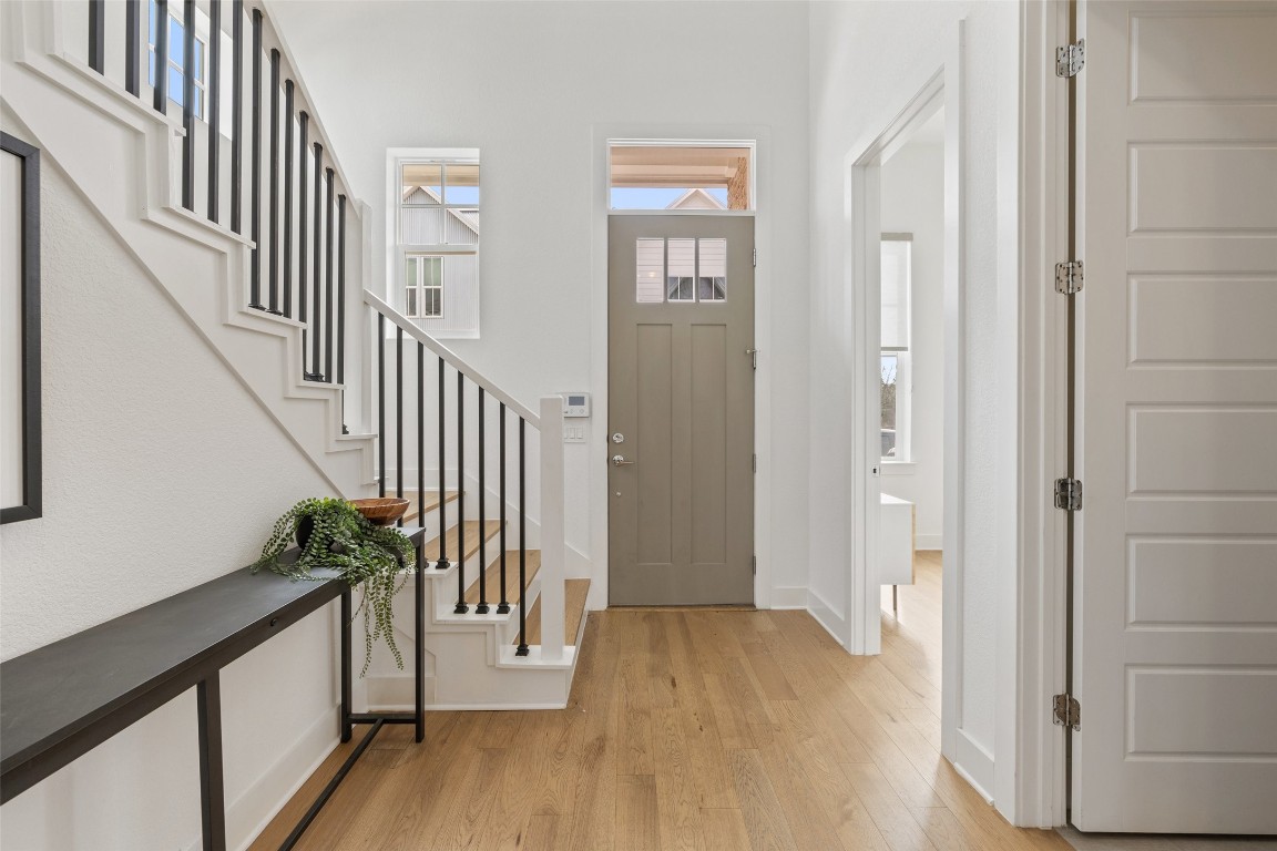 4400 Night Owl Lane Austin, TX 78723 - Photo 19 of 40 a view of entryway with wooden floor and stairs