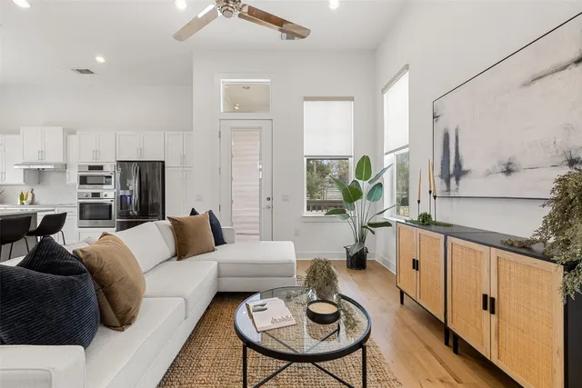 a living room with furniture and a table