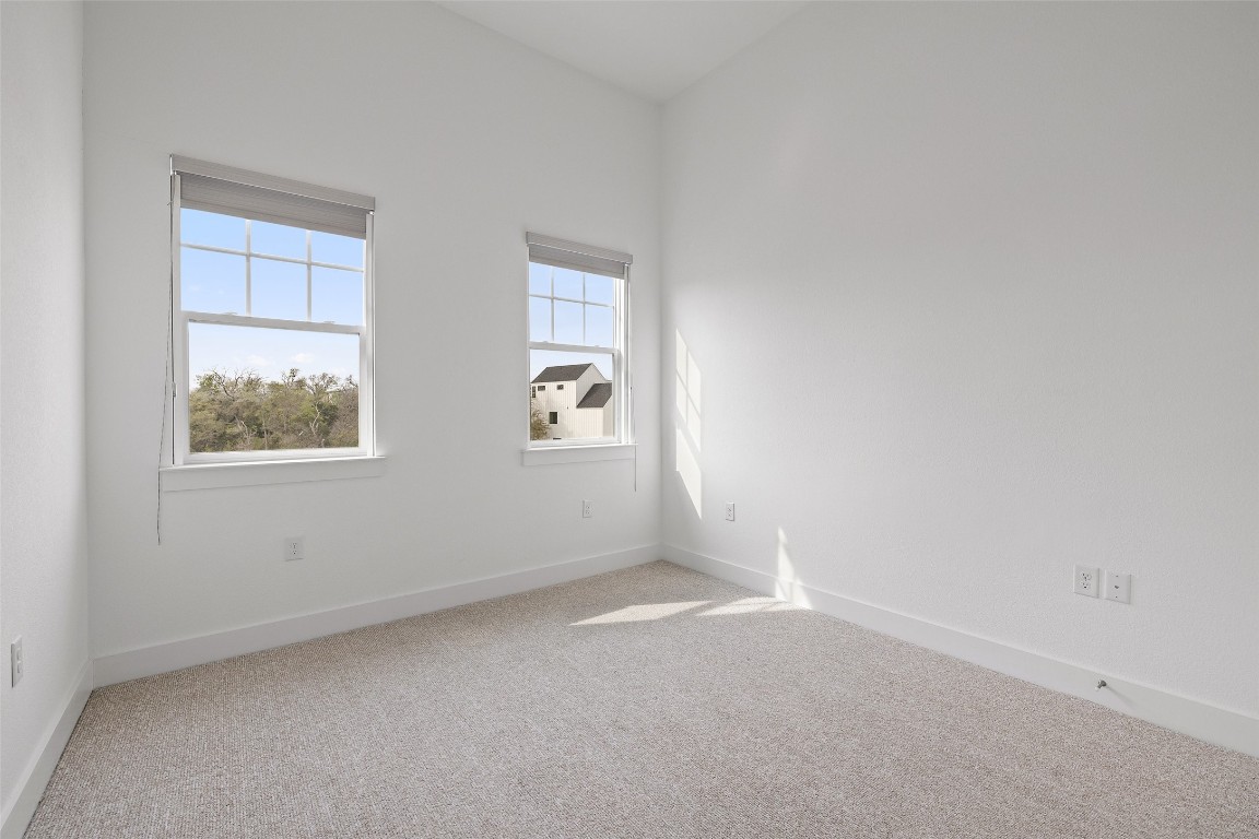4400 Night Owl Lane Austin, TX 78723 - Photo 30 of 40 an empty room with windows