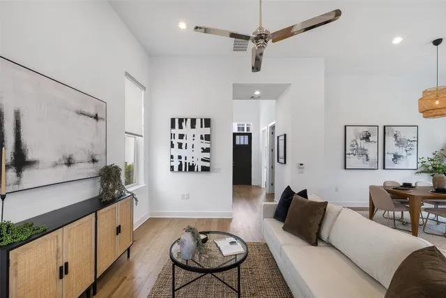 a living room with furniture and a table