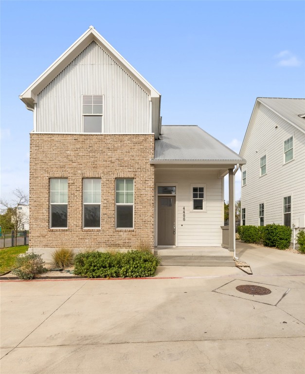 4400 Night Owl Lane Austin, TX 78723 - Photo 40 of 40 a front view of a house with a yard and garage