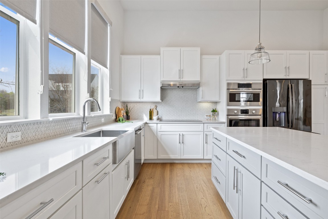 4400 Night Owl Lane Austin, TX 78723 - Photo 10 of 40 a kitchen with refrigerator and window